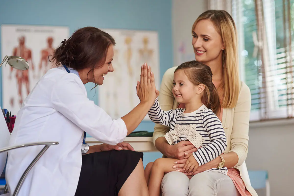 smiling girl during a pediatric doctor appointment
